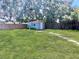 Backyard with shed and stone pathway at 1206 Osceola Ave, Tavares, FL 32778