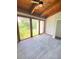 Spacious bedroom featuring wood ceilings and treetop views at 5341 Indian Creek Dr # B, Orlando, FL 32811