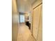 Double vanity bathroom with beige tile floor and linen closet at 5341 Indian Creek Dr # B, Orlando, FL 32811