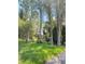 Lush backyard with pond view and mature trees at 5341 Indian Creek Dr # B, Orlando, FL 32811