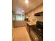 Modern kitchen with granite countertops and stainless steel appliances at 5341 Indian Creek Dr # B, Orlando, FL 32811