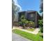 Dark brown two-story condo with wood siding and a small fenced yard at 5341 Indian Creek Dr # B, Orlando, FL 32811