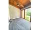 Bright bedroom with wood ceilings, grey carpet, and large windows at 5341 Indian Creek Dr # B, Orlando, FL 32811