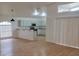 Modern kitchen with light blue cabinets and granite countertops at 1025 W Lake Hamilton Dr, Winter Haven, FL 33881