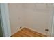 Convenient laundry closet with shelving and flooring at 1025 W Lake Hamilton Dr, Winter Haven, FL 33881