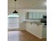 Kitchen with light blue cabinets, granite countertops, and a breakfast bar at 1025 W Lake Hamilton Dr, Winter Haven, FL 33881
