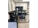 Modern kitchen with stainless steel appliances and granite countertops at 6165 Carrier Dr # 3413, Orlando, FL 32819