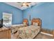 Bright bedroom featuring twin beds, a ceiling fan, and a view of the pool at 7975 Sea Pearl Cir, Kissimmee, FL 34747