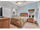 Guest bedroom with double bed and light wood furnishings at 7975 Sea Pearl Cir, Kissimmee, FL 34747