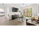 Open living area with flat-screen TV and access to patio at 1370 Tuscan Ter # 2104, Davenport, FL 33896