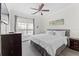 King-size bed, ceiling fan, and ample closet space at 1370 Tuscan Ter # 2104, Davenport, FL 33896