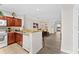 Open kitchen with island, granite counters, and breakfast bar at 1370 Tuscan Ter # 2104, Davenport, FL 33896