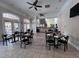 Community room with tables, chairs, and a kitchen area at 1370 Tuscan Ter # 2104, Davenport, FL 33896