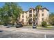 Tuscan-style condominium building with parking at 1370 Tuscan Ter # 2104, Davenport, FL 33896