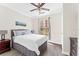 Bright bedroom with a king-size bed and ceiling fan at 1370 Tuscan Ter # 2104, Davenport, FL 33896