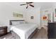 King-size bed, ceiling fan, and ample closet space at 1370 Tuscan Ter # 2104, Davenport, FL 33896