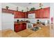Well-equipped kitchen featuring dark wood cabinets and granite countertops at 1370 Tuscan Ter # 2104, Davenport, FL 33896