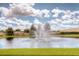 Community pond with water fountain at 9355 Sommerset Hills Dr # 9355, Davenport, FL 33896