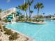 Large water slide emptying into a leisure pool at 9355 Sommerset Hills Dr # 9355, Davenport, FL 33896