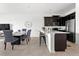 Open concept kitchen with island seating and stainless steel appliances at 9355 Sommerset Hills Dr # 9355, Davenport, FL 33896