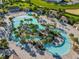 Lazy river pool with water slide and plenty of lounge chairs at 9355 Sommerset Hills Dr # 9355, Davenport, FL 33896
