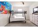 bedroom with bunk beds, dresser, and large wall art at 9355 Sommerset Hills Dr # 9355, Davenport, FL 33896