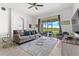 Comfortable living room with gray sofa and a view of the backyard at 9355 Sommerset Hills Dr # 9355, Davenport, FL 33896