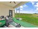Screened patio with outdoor furniture and view of yard at 9355 Sommerset Hills Dr # 9355, Davenport, FL 33896