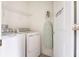 Laundry room with washer, dryer, ironing board, and shelving at 9355 Sommerset Hills Dr # 9355, Davenport, FL 33896