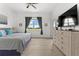 Spacious bedroom with large window, dresser, and king-size bed at 9355 Sommerset Hills Dr # 9355, Davenport, FL 33896