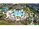 Relaxing pool with lounge chairs, putting green, and cabanas at 9355 Sommerset Hills Dr # 9355, Davenport, FL 33896