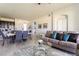 Open concept living room with kitchen and dining areas visible at 9355 Sommerset Hills Dr # 9355, Davenport, FL 33896