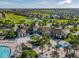 Aerial view of community with clubhouse and golf course at 9355 Sommerset Hills Dr # 9355, Davenport, FL 33896