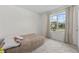 Simple bedroom with a bed and large window at 2807 Harmonia Hammock Rd, Harmony, FL 34773