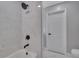 Updated bathroom with marble tile and black fixtures at 3722 Paige St, Port Orange, FL 32129