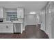 Renovated kitchen with stainless steel dishwasher and white cabinets at 3722 Paige St, Port Orange, FL 32129