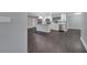Modern kitchen features white cabinets, a large island, stainless steel appliances and dark flooring at 3722 Paige St, Port Orange, FL 32129