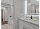 Clean bathroom with white vanity and a large mirror at 3722 Paige St, Port Orange, FL 32129