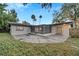 House with backyard, screened patio, and grassy area at 3722 Paige St, Port Orange, FL 32129