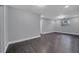 Bright bedroom with window and dark hardwood floors at 3722 Paige St, Port Orange, FL 32129