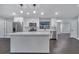 Modern kitchen with white cabinets, quartz countertops, and stainless steel appliances at 3722 Paige St, Port Orange, FL 32129