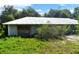 Ranch-style home with metal roof, needing repairs at 2795 Absher Rd, Saint Cloud, FL 34771