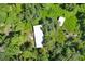 Aerial view of property showing a white building amongst trees at 2795 Absher Rd, Saint Cloud, FL 34771