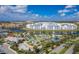 Aerial view of a community with resort-style pool, water features, and modern apartment buildings at 4222 Paragraph Dr, Kissimmee, FL 34746