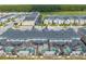 Aerial view of townhomes with private screened pools and a lake at 4222 Paragraph Dr, Kissimmee, FL 34746
