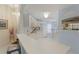 Bright kitchen with white cabinets, and view to Gathering room at 405 High Vista Dr, Davenport, FL 33837