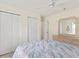 Bedroom with double bed, dresser, and ceiling fan at 405 High Vista Dr, Davenport, FL 33837
