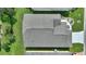 Aerial view of house showing gray roof and landscaping at 405 High Vista Dr, Davenport, FL 33837