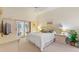 Comfortable main bedroom with a TV and sliding glass doors at 405 High Vista Dr, Davenport, FL 33837
