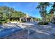 Gated entrance to the community with palm trees and landscaping at 405 High Vista Dr, Davenport, FL 33837